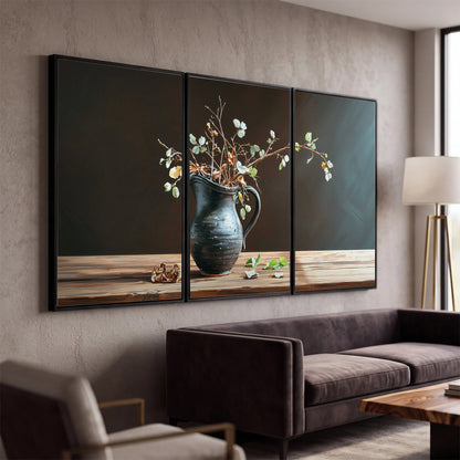 A delicate arrangement of pale blossoms in a blue vase on a sunlit wooden table 3 piece framed canvas wall art displayed in a modern living room