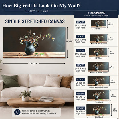 A delicate arrangement of pale blossoms in a blue vase on a sunlit wooden table single canvas wall art size guide above a sofa; room view is illustrative