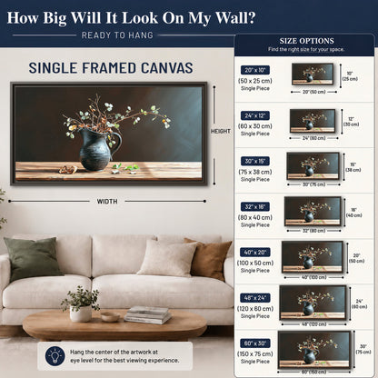 A delicate arrangement of pale blossoms in a blue vase on a sunlit wooden table single framed canvas wall art size guide above a sofa; room view is illustrative