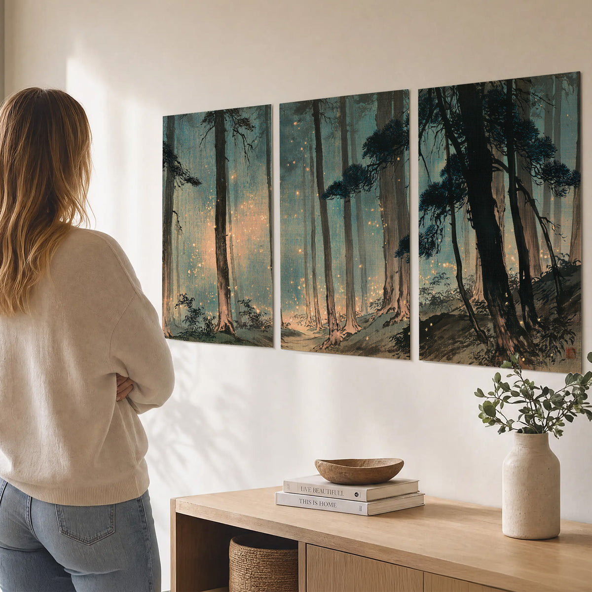 Warm shafts of light falling between tall dark pine trees in a misty green forest set of 3 poster prints three panel arrangement on a wall