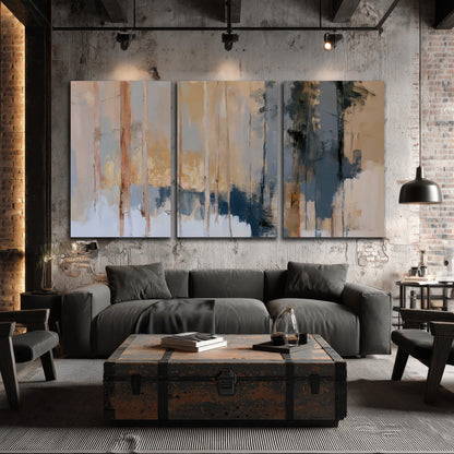 Vertical strokes of cream, blue and ochre suggesting a quiet woodland 3 piece canvas wall art displayed in a industrial room