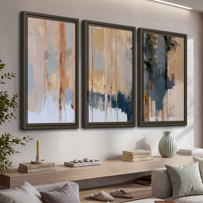 Vertical strokes of cream, blue and ochre suggesting a quiet woodland 3 piece framed canvas wall art displayed in a console