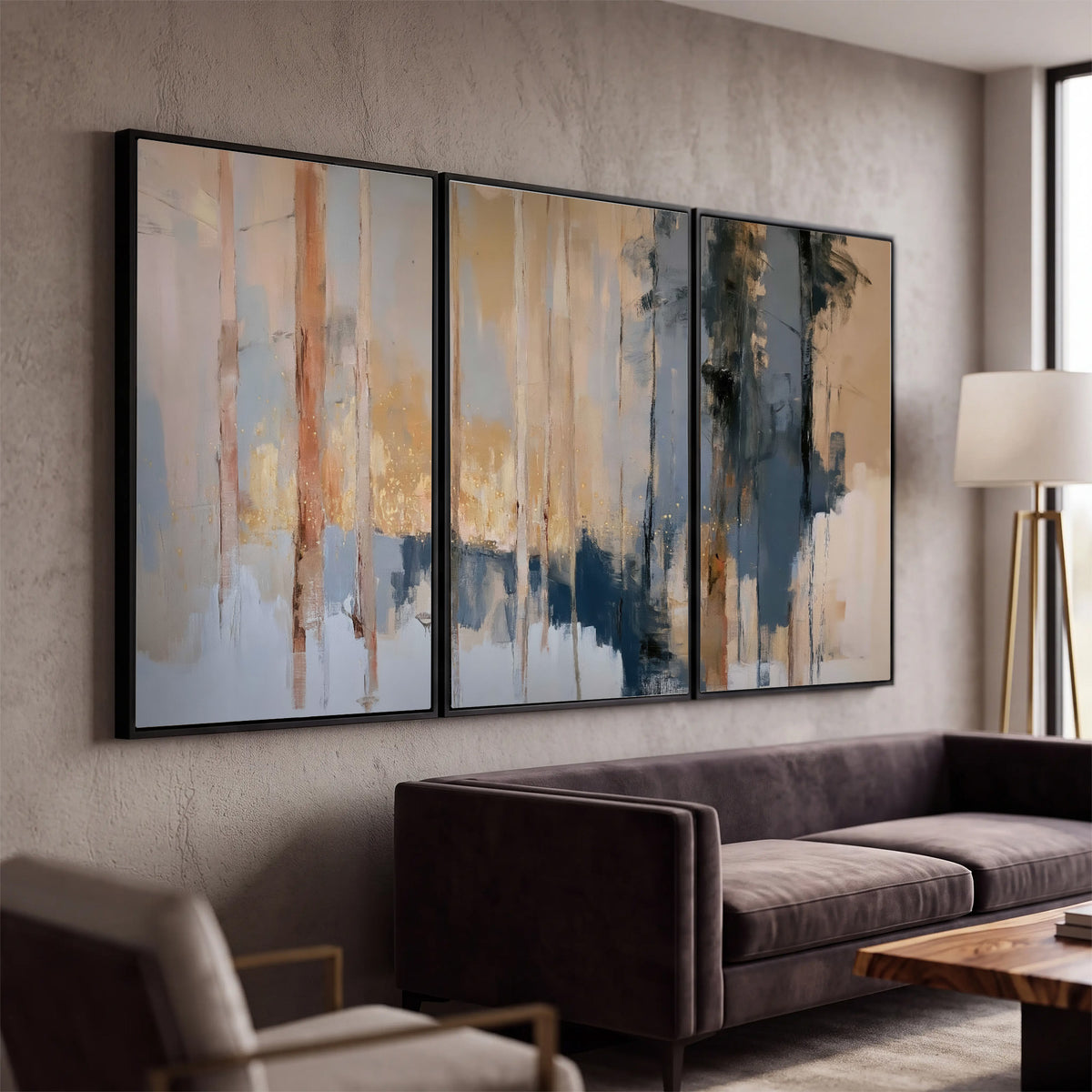 Vertical strokes of cream, blue and ochre suggesting a quiet woodland 3 piece framed canvas wall art displayed in a modern living room