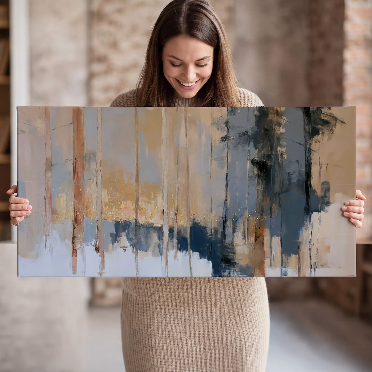 Vertical strokes of cream, blue and ochre suggesting a quiet woodland single canvas wall art held in hands