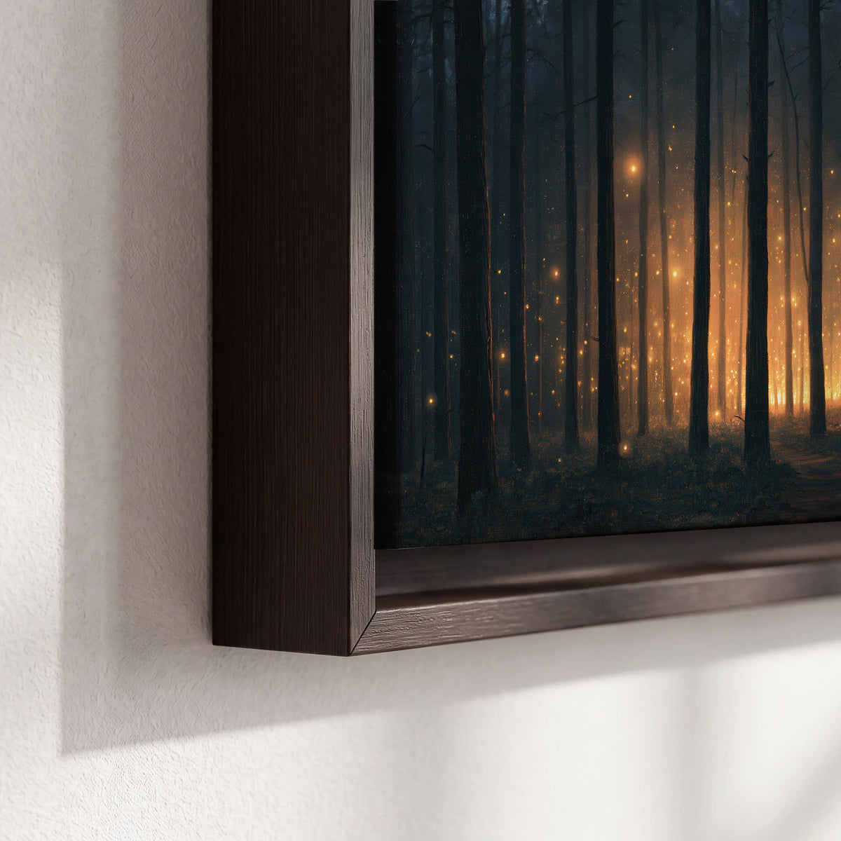A warm amber glow shining between closely spaced dark forest trunks 3 piece framed canvas wall art material and edge close up