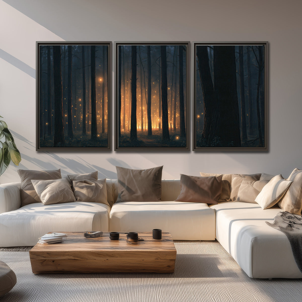 A warm amber glow shining between closely spaced dark forest trunks 3 piece framed canvas wall art displayed in a living room