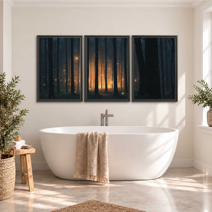 A warm amber glow shining between closely spaced dark forest trunks 3 piece framed canvas wall art styled in an interior
