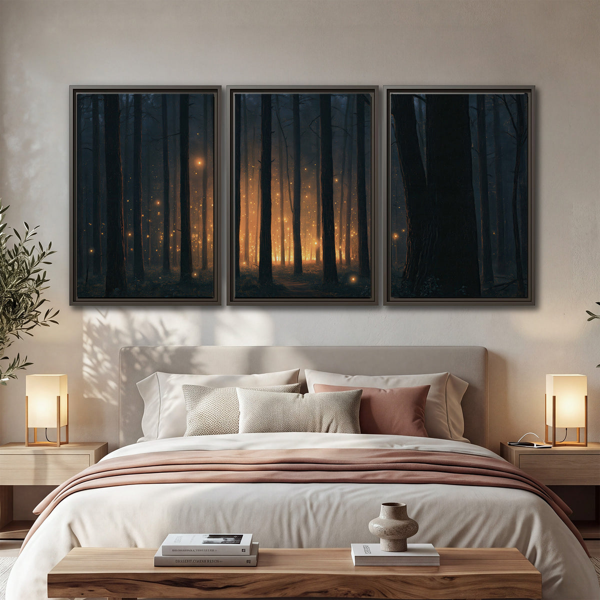 A warm amber glow shining between closely spaced dark forest trunks 3 piece framed canvas wall art displayed in a bedroom