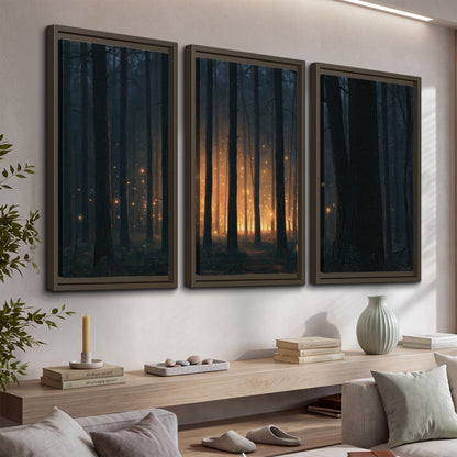 A warm amber glow shining between closely spaced dark forest trunks 3 piece framed canvas wall art displayed in a console
