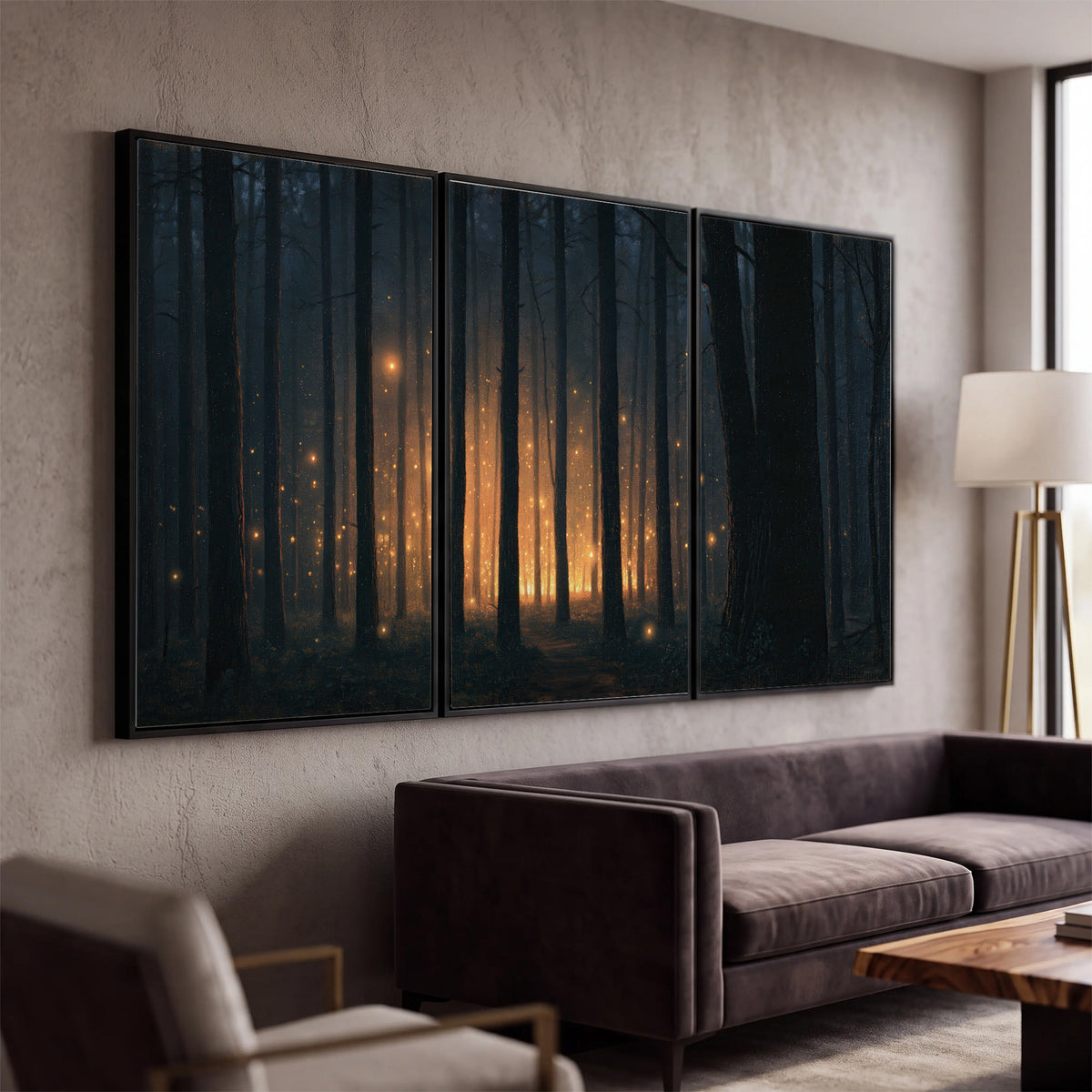 A warm amber glow shining between closely spaced dark forest trunks 3 piece framed canvas wall art displayed in a modern living room