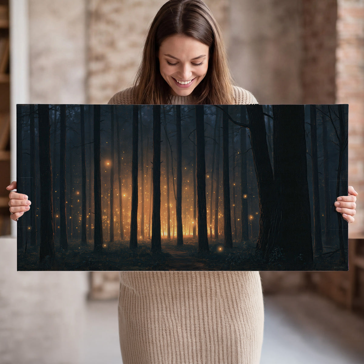 A warm amber glow shining between closely spaced dark forest trunks single canvas wall art held in hands