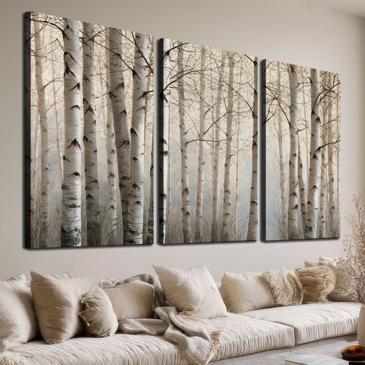 Pale birch trunks and delicate bare branches in a soft neutral woodland 3 piece canvas wall art room and product view
