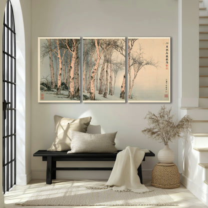 Slender pale birches in a muted woodland scene with decorative script 3 piece canvas wall art displayed in a entryway