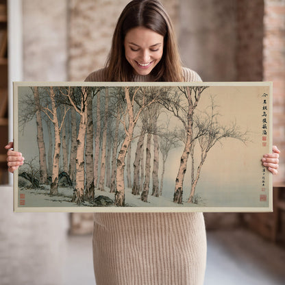Slender pale birches in a muted woodland scene with decorative script single canvas wall art held in hands