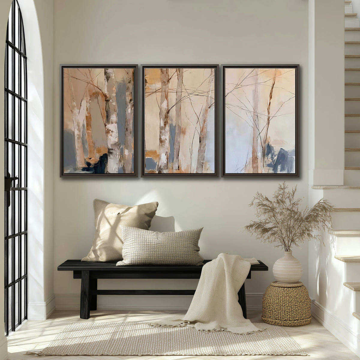 Loose pale blue, peach and cream strokes suggesting a stand of birch trees 3 piece framed canvas wall art displayed in a entryway