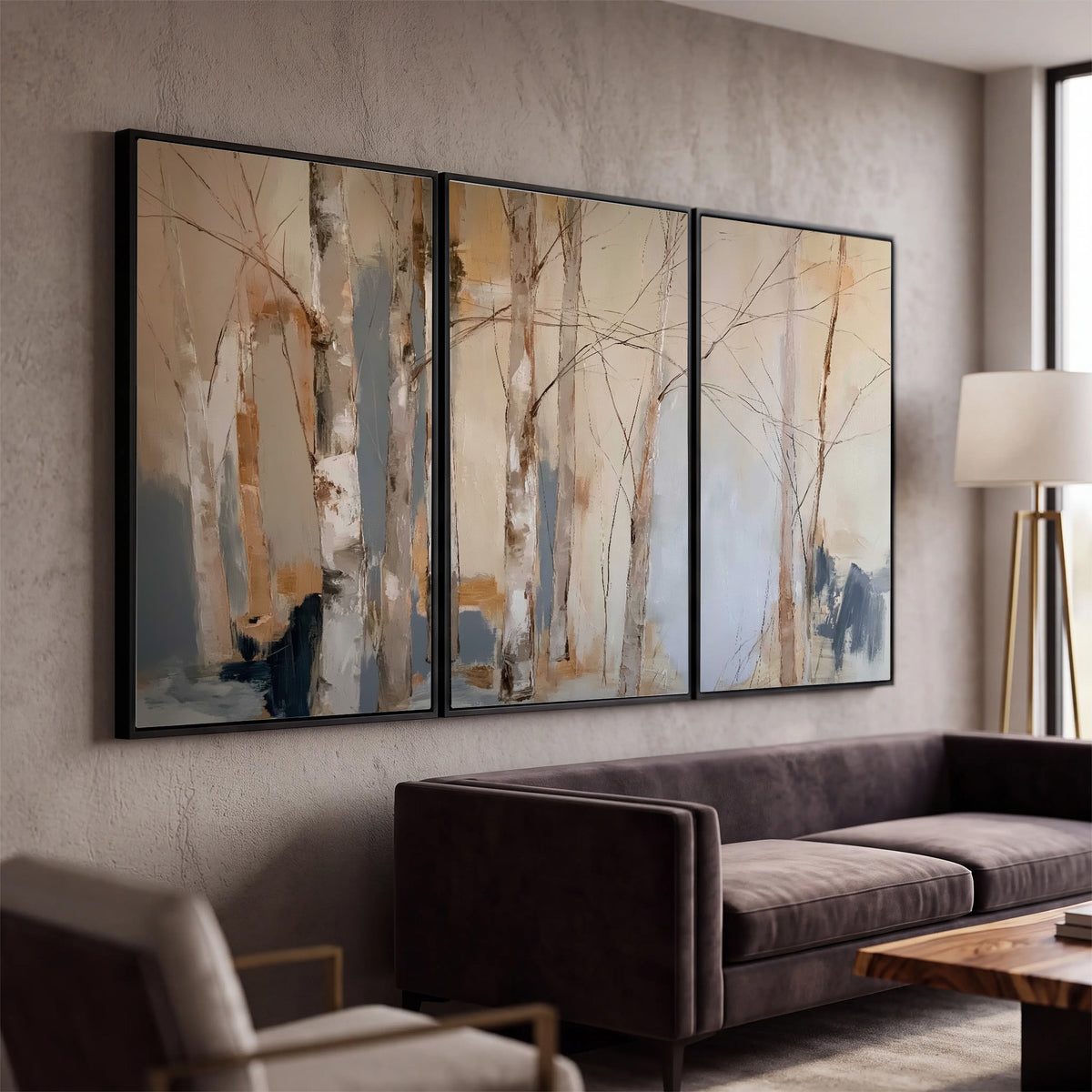 Loose pale blue, peach and cream strokes suggesting a stand of birch trees 3 piece framed canvas wall art displayed in a modern living room