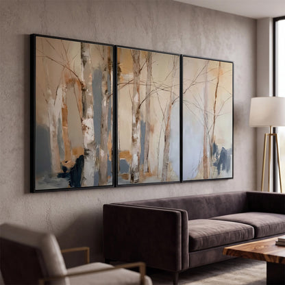 Loose pale blue, peach and cream strokes suggesting a stand of birch trees 3 piece framed canvas wall art displayed in a modern living room
