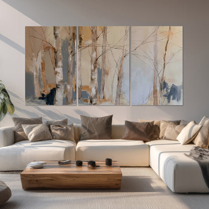 Loose pale blue, peach and cream strokes suggesting a stand of birch trees set of 3 poster prints displayed in a living room
