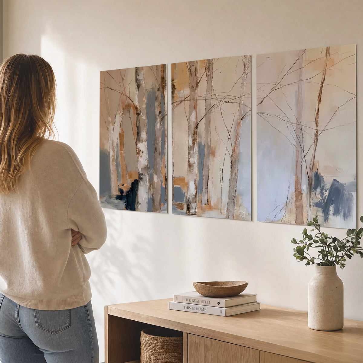 Loose pale blue, peach and cream strokes suggesting a stand of birch trees set of 3 poster prints three panel arrangement on a wall