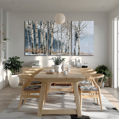 A line of bare birch trees against a cool blue-gray sky 3 piece canvas wall art room and product view