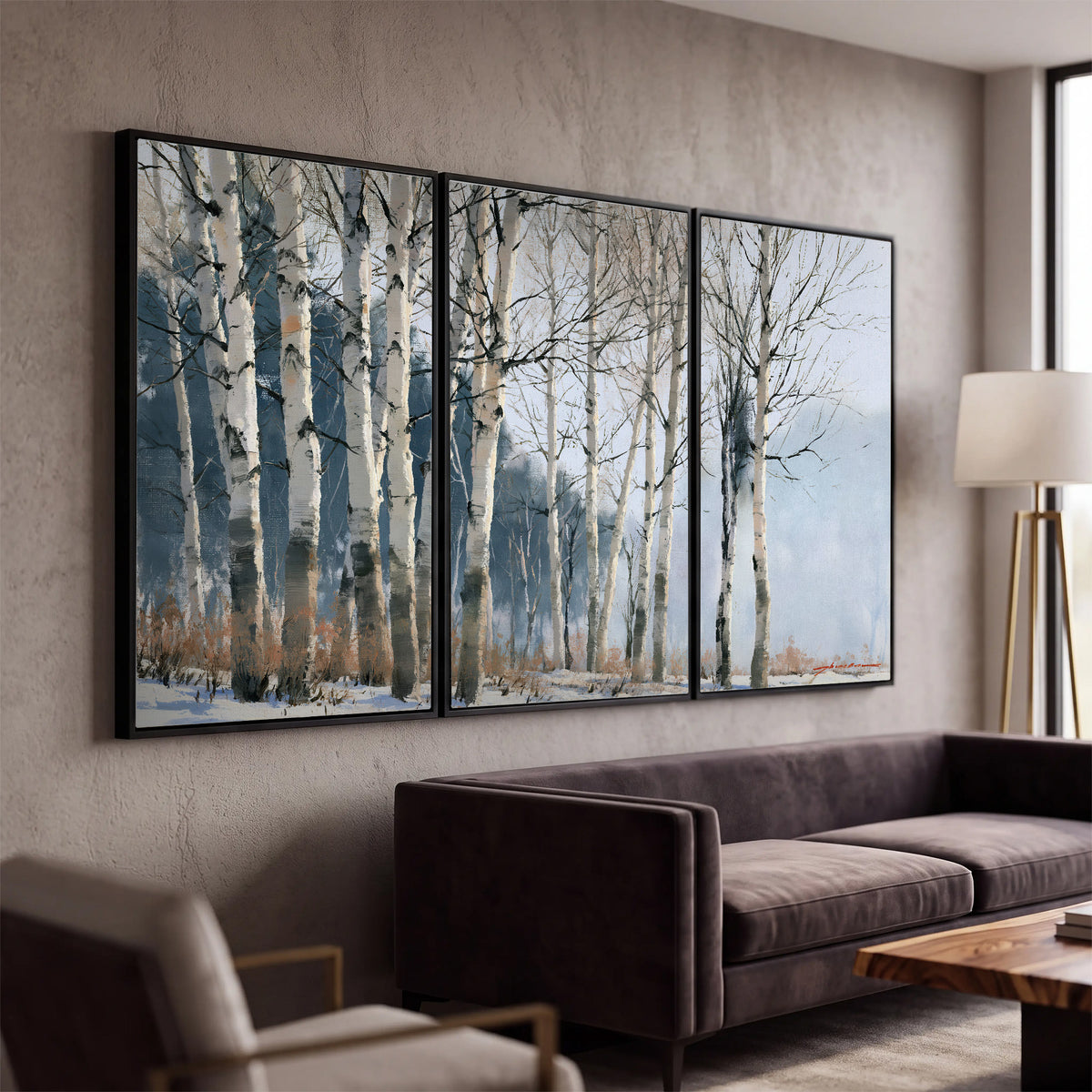 A line of bare birch trees against a cool blue-gray sky 3 piece framed canvas wall art displayed in a modern living room