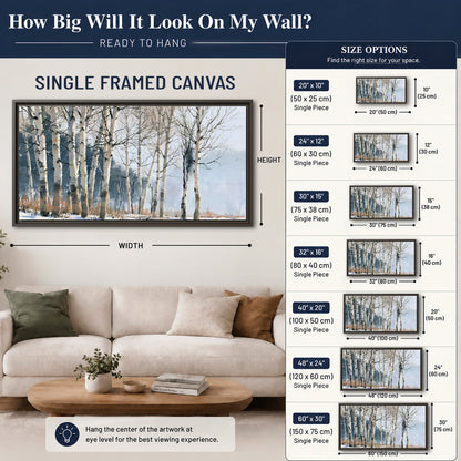 A line of bare birch trees against a cool blue-gray sky single framed canvas wall art size guide above a sofa; room view is illustrative