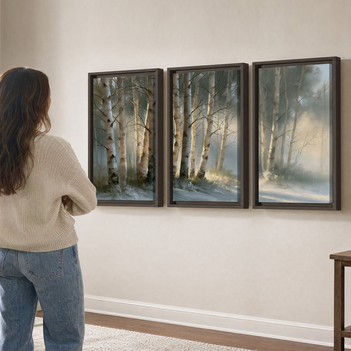 A softly lit woodland path winding between pale birch trunks 3 piece framed canvas wall art three panel arrangement on a wall