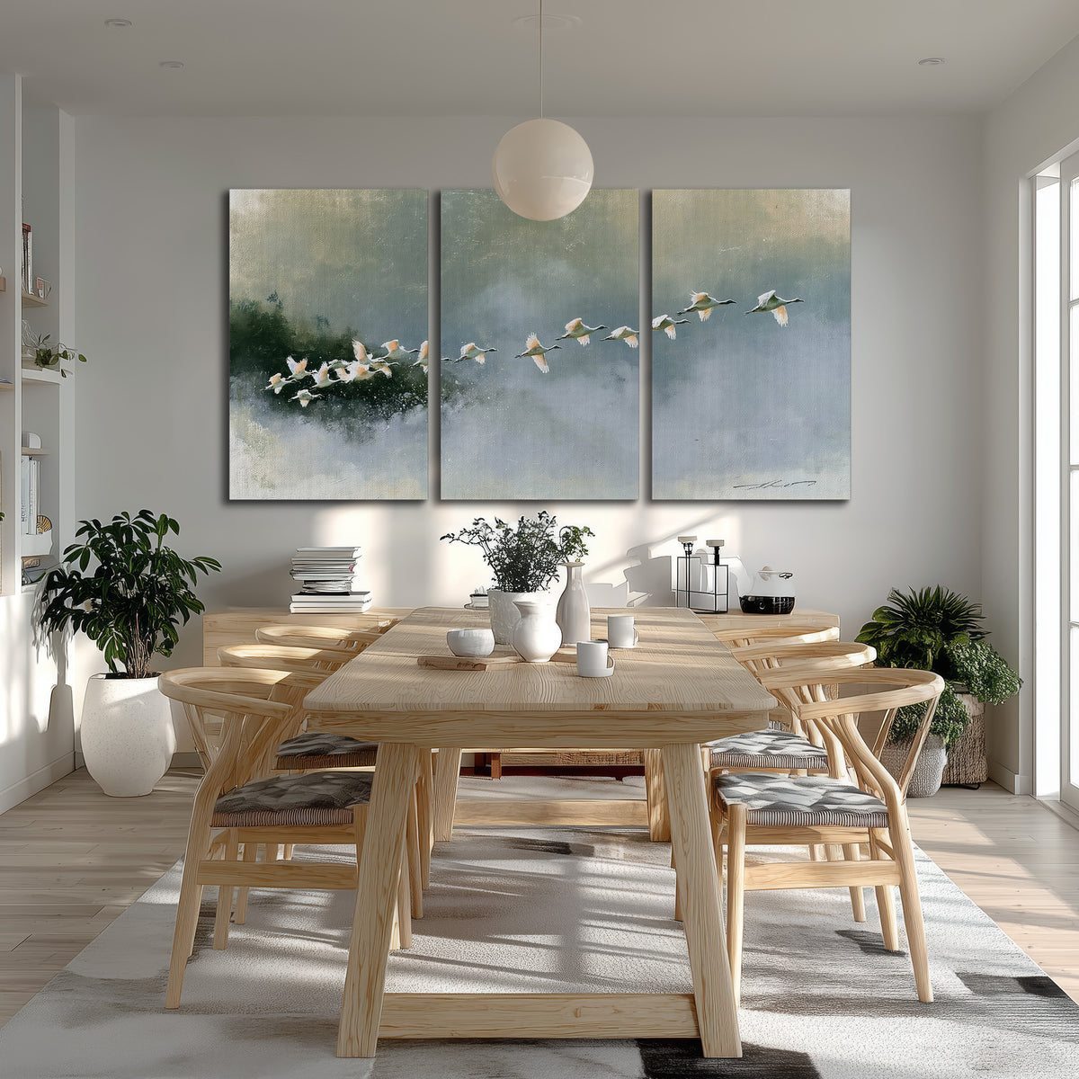 A flock of white birds flying low above a quiet blue-green lake 3 piece canvas wall art room and product view