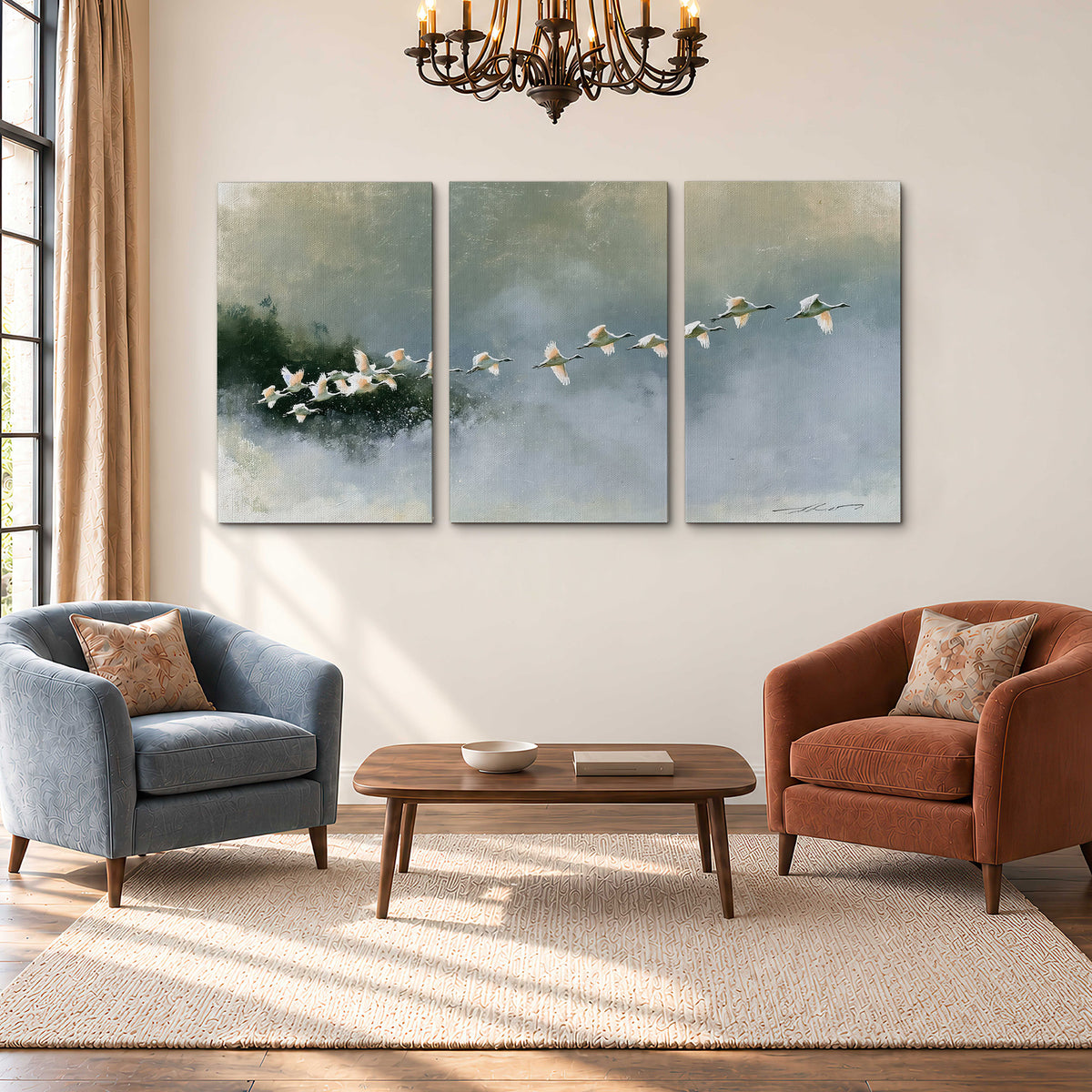 A flock of white birds flying low above a quiet blue-green lake 3 piece canvas wall art styled in an interior