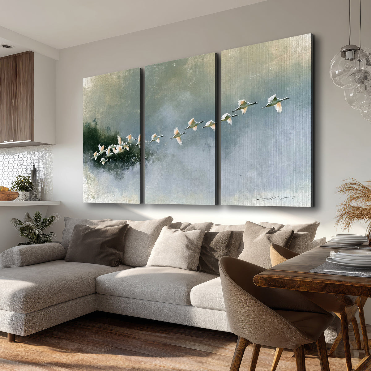 A flock of white birds flying low above a quiet blue-green lake 3 piece canvas wall art room and product view