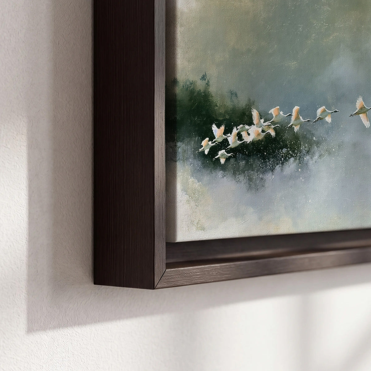 A flock of white birds flying low above a quiet blue-green lake 3 piece framed canvas wall art material and edge close up