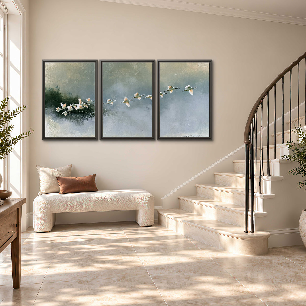 A flock of white birds flying low above a quiet blue-green lake 3 piece framed canvas wall art styled in an interior