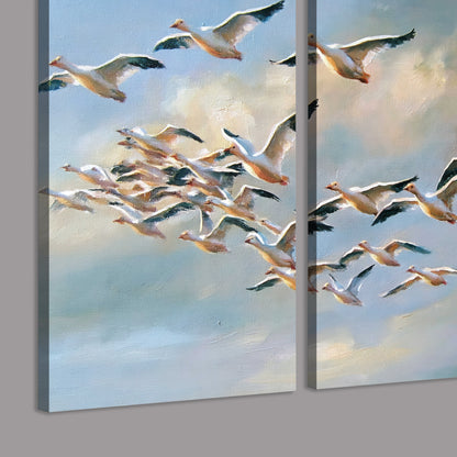 A flock of pale seabirds gliding beneath soft clouds across a blue sky 3 piece canvas wall art room and product view