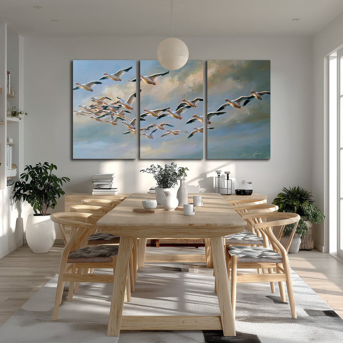 A flock of pale seabirds gliding beneath soft clouds across a blue sky 3 piece canvas wall art room and product view