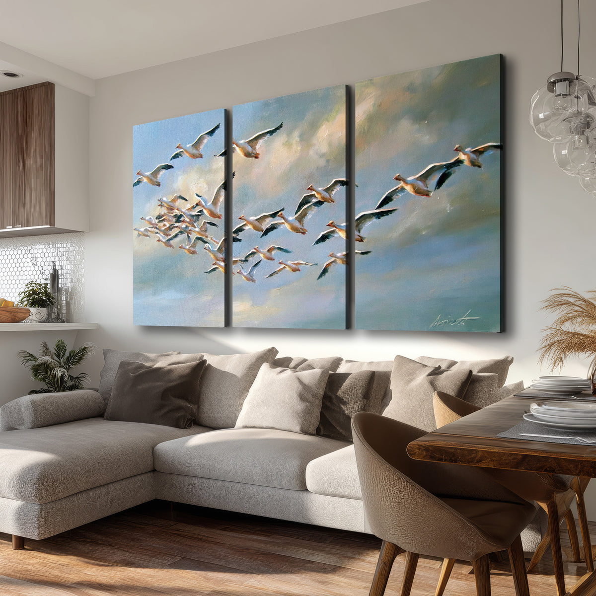 A flock of pale seabirds gliding beneath soft clouds across a blue sky 3 piece canvas wall art room and product view