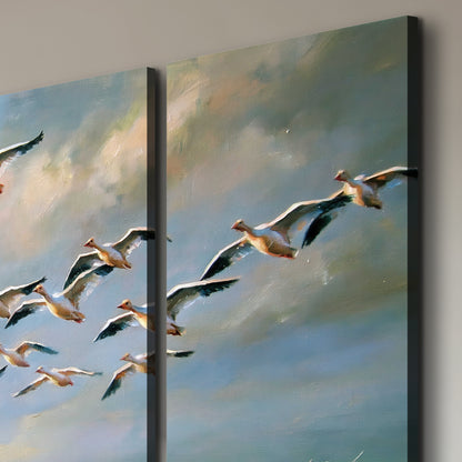 A flock of pale seabirds gliding beneath soft clouds across a blue sky 3 piece canvas wall art room and product view