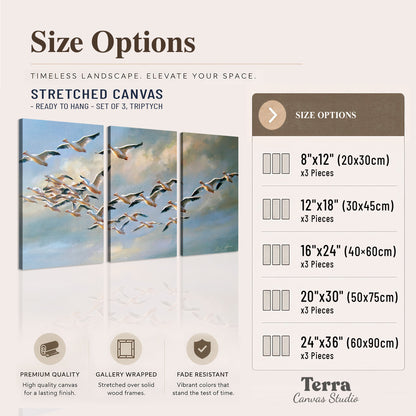 A flock of pale seabirds gliding beneath soft clouds across a blue sky 3 piece canvas wall art available dimensions; triptych dimensions are per panel
