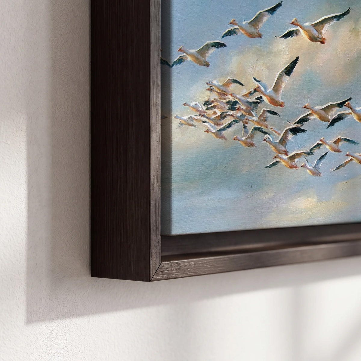 A flock of pale seabirds gliding beneath soft clouds across a blue sky 3 piece framed canvas wall art material and edge close up