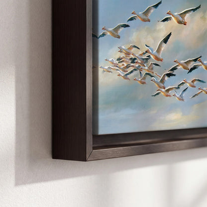 A flock of pale seabirds gliding beneath soft clouds across a blue sky 3 piece framed canvas wall art material and edge close up