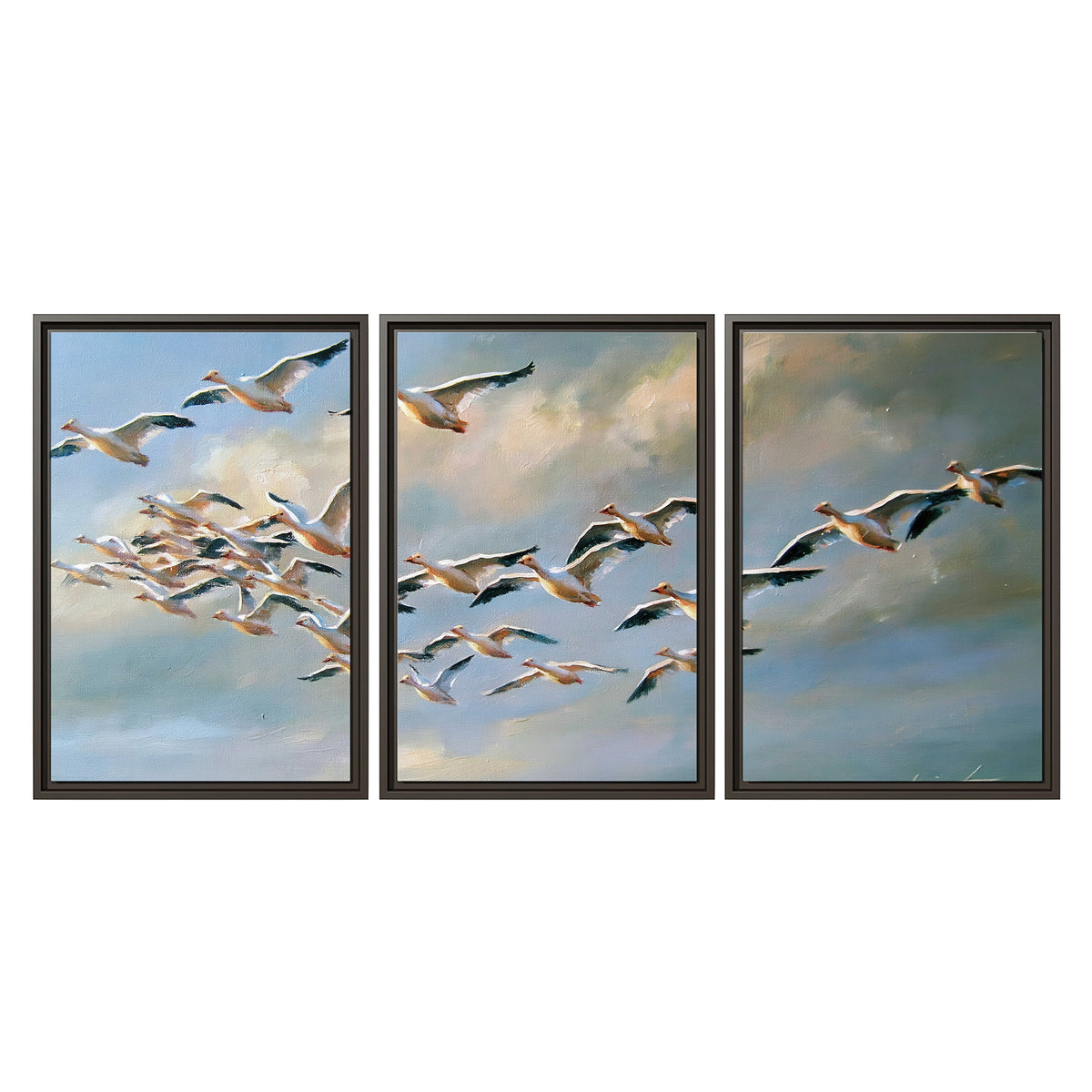 A flock of pale seabirds gliding beneath soft clouds across a blue sky 3 piece framed canvas wall art viewed straight on