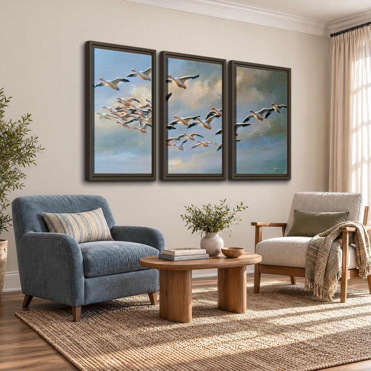 A flock of pale seabirds gliding beneath soft clouds across a blue sky 3 piece framed canvas wall art styled in an interior