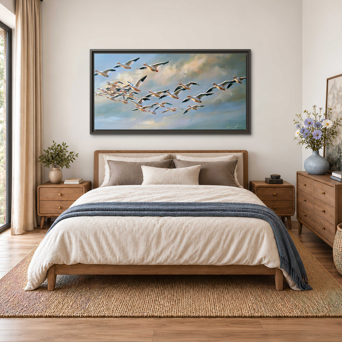 A flock of pale seabirds gliding beneath soft clouds across a blue sky single framed canvas wall art styled in an interior