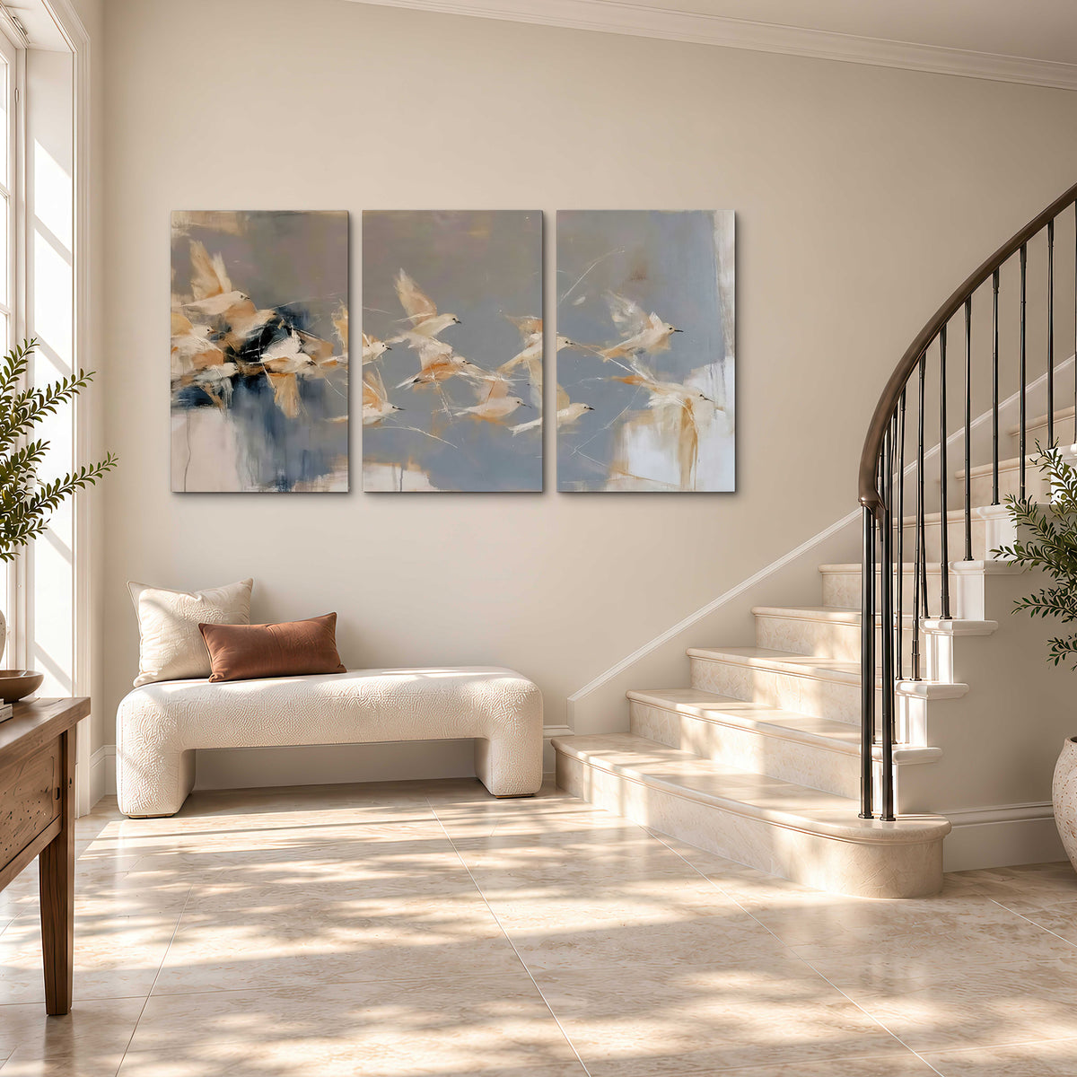 Pale bird-like forms sweeping across layered strokes of blue, ochre and cream 3 piece canvas wall art styled in an interior
