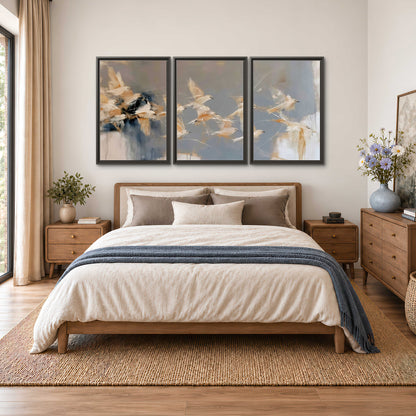 Pale bird-like forms sweeping across layered strokes of blue, ochre and cream 3 piece framed canvas wall art styled in an interior