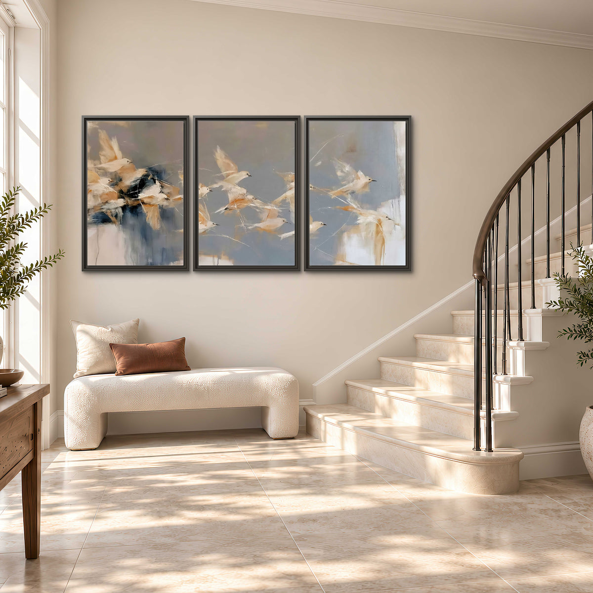Pale bird-like forms sweeping across layered strokes of blue, ochre and cream 3 piece framed canvas wall art styled in an interior