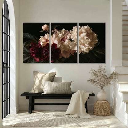 Full ivory and deep burgundy peonies against a dark green background 3 piece canvas wall art displayed in a entryway