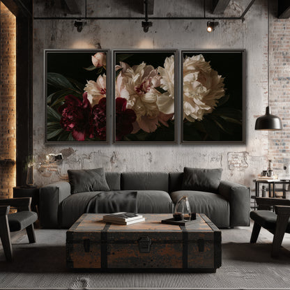 Full ivory and deep burgundy peonies against a dark green background 3 piece framed canvas wall art displayed in a industrial room