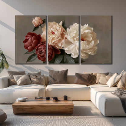 Large blush peonies and rust-colored flowers in a softly shaded arrangement 3 piece canvas wall art displayed in a living room