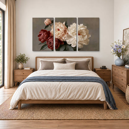 Large blush peonies and rust-colored flowers in a softly shaded arrangement 3 piece canvas wall art styled in an interior