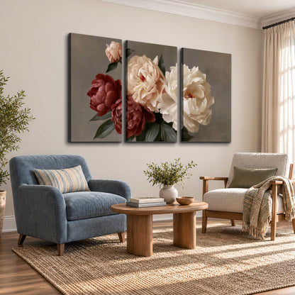Large blush peonies and rust-colored flowers in a softly shaded arrangement 3 piece canvas wall art styled in an interior